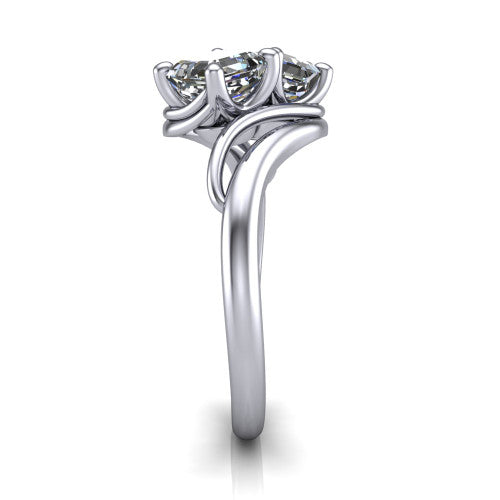 Julianna square emerald three stone engagement ring in Platinum, side profile showing the multi-ribbon shoulders curving around the head before rejoining as one band