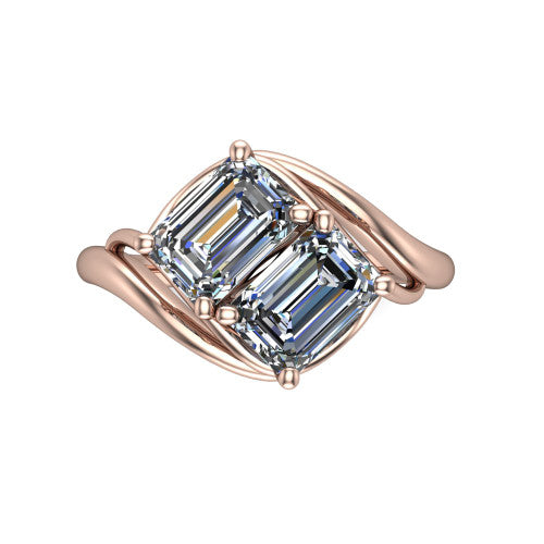 Julianna emerald three stone engagement ring in 18K Rose Gold, top-down view showing two step-cut emerald diamonds set diagonally in a toi et moi arrangement embraced by polished ribbon shoulders