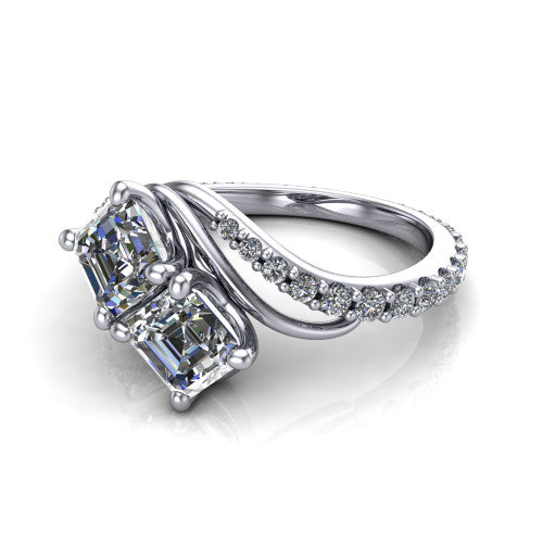 Gwen square emerald three stone engagement ring in Platinum, three-quarter perspective showing two step-cut square emerald diamonds set diagonally on a pave wraparound shank with bypass curving shoulders