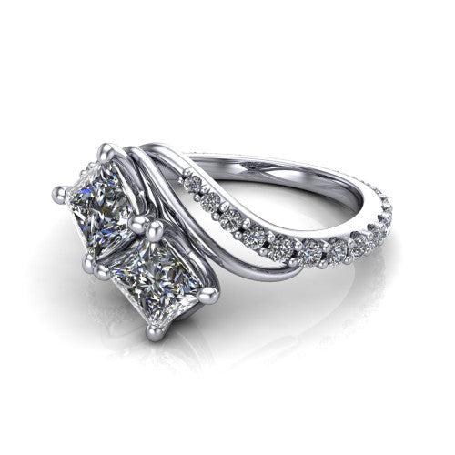 Gwen princess three stone engagement ring in Platinum, three-quarter perspective showing two brilliant princess-cut diamonds set diagonally on a pave wraparound shank with bypass curving shoulders