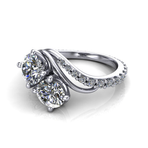 Gwen round three stone engagement ring in Platinum, three-quarter perspective showing two brilliant round diamonds set diagonally on a pave wraparound shank with bypass curving shoulders