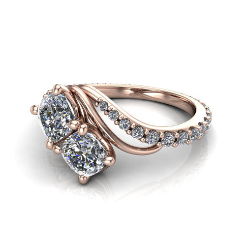 Gwen cushion three stone engagement ring in 14K Rose Gold, three-quarter perspective showing two brilliant cushion-cut diamonds set diagonally on a pave wraparound shank with bypass curving shoulders