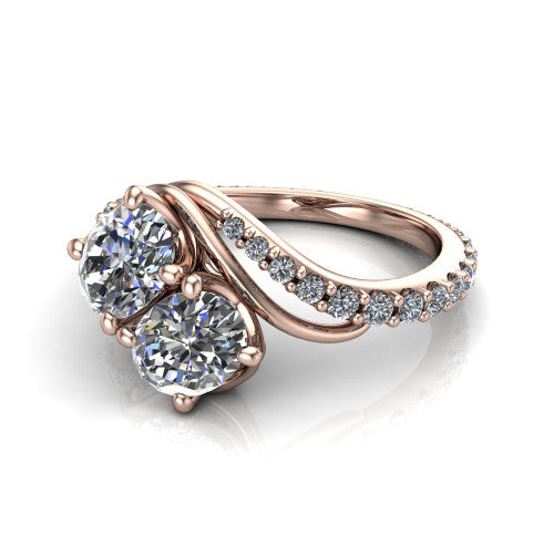 Gwen oval three stone engagement ring in 18K Rose Gold, three-quarter perspective showing two brilliant oval diamonds set diagonally on a pave wraparound shank with bypass curving shoulders