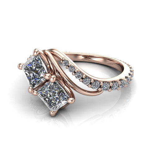 Gwen princess three stone engagement ring in 14K Rose Gold, three-quarter perspective showing two brilliant princess-cut diamonds set diagonally on a pave wraparound shank with bypass curving shoulders