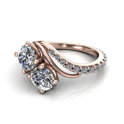 Gwen round three stone engagement ring in 18K Rose Gold, three-quarter perspective showing two brilliant round diamonds set diagonally on a pave wraparound shank with bypass curving shoulders