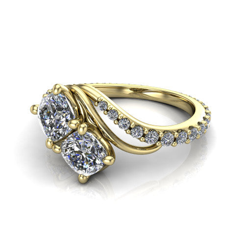 Gwen cushion three stone engagement ring in 14K Yellow Gold, three-quarter perspective showing two brilliant cushion-cut diamonds set diagonally on a pave wraparound shank with bypass curving shoulders