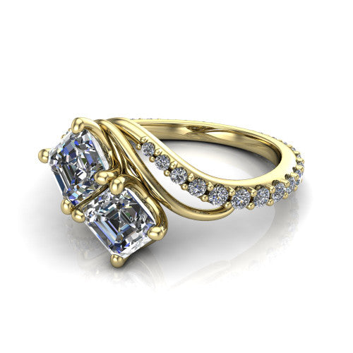 Gwen square emerald three stone engagement ring in 14K Yellow Gold, three-quarter perspective showing two step-cut square emerald diamonds set diagonally on a pave wraparound shank with bypass curving shoulders