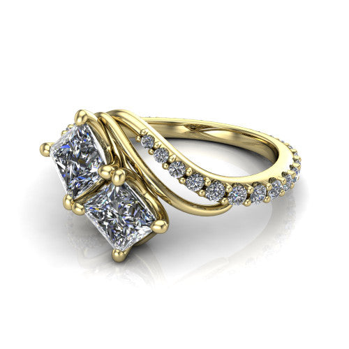 Gwen princess three stone engagement ring in 14K Yellow Gold, three-quarter perspective showing two brilliant princess-cut diamonds set diagonally on a pave wraparound shank with bypass curving shoulders
