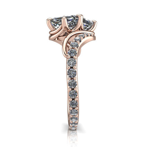 Gwen square emerald three stone engagement ring in 18K Rose Gold, side profile showing the bypass curving shoulders and pave diamonds wrapping the top and outer sides of the shank