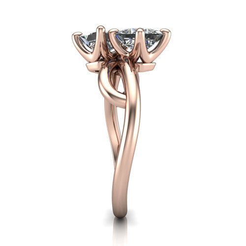 Mya princess three stone engagement ring in 18K Rose Gold, side profile showing the band crossing beneath the head as a smooth polished infinity loop