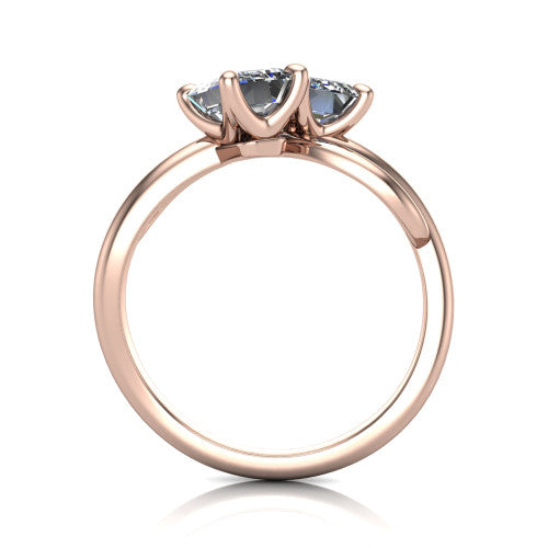 Mya emerald three stone engagement ring in 14K Rose Gold, through-finger front profile showing the two-stone head and polished infinity-loop band