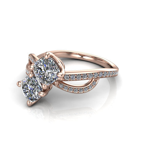 Angelina cushion three stone engagement ring in 14K Rose Gold, three-quarter perspective showing two brilliant cushion-cut diamonds set diagonally on a pave infinity-loop shank