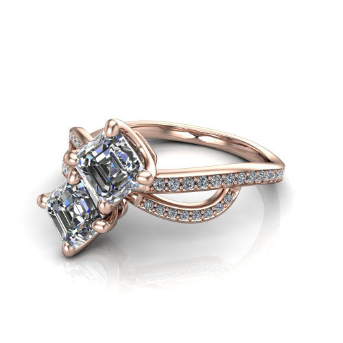Angelina square emerald three stone engagement ring in 14K Rose Gold, three-quarter perspective showing two step-cut square emerald diamonds set diagonally on a pave infinity-loop shank