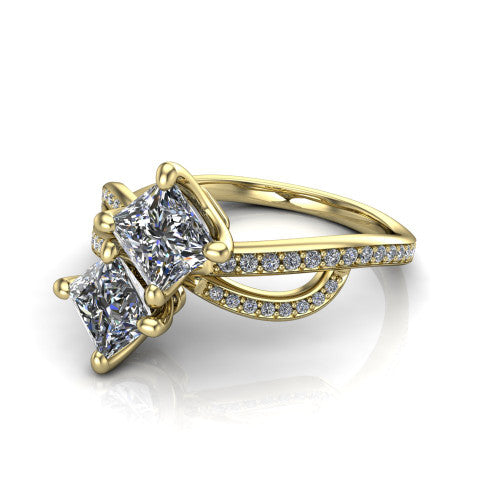 Angelina princess three stone engagement ring in 14K Yellow Gold, three-quarter perspective showing two brilliant princess-cut diamonds set diagonally on a pave infinity-loop shank
