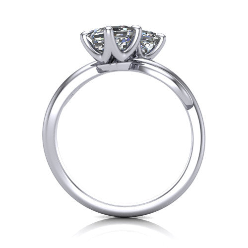 Angelina square emerald three stone engagement ring in Platinum, through-finger front profile showing the two-stone head and pave infinity-loop band