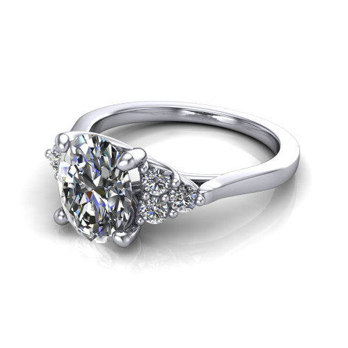 Raegan oval three stone engagement ring in 14K White Gold, three-quarter perspective showing the brilliant oval center diamond flanked by two triangular clusters of small round accent diamonds