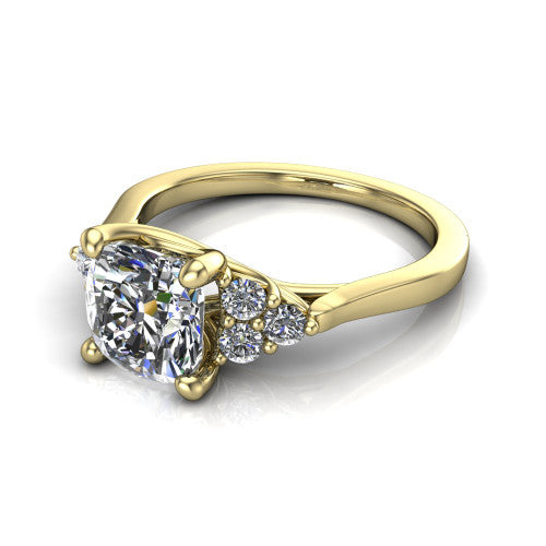 Raegan cushion three stone engagement ring in 18K Yellow Gold, three-quarter perspective showing the brilliant cushion-cut center diamond flanked by two triangular clusters of small round accent diamonds