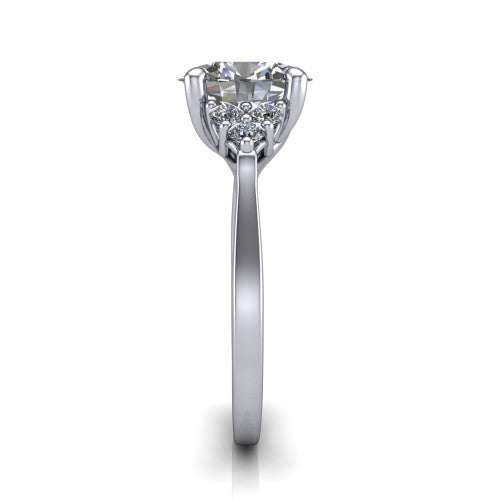 Raegan oval three stone engagement ring in 18K White Gold, side profile showing the cluster head, tall basket, and slim polished band