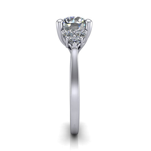 Raegan round three stone engagement ring in 18K White Gold, side profile showing the cluster head, tall basket, and slim polished band