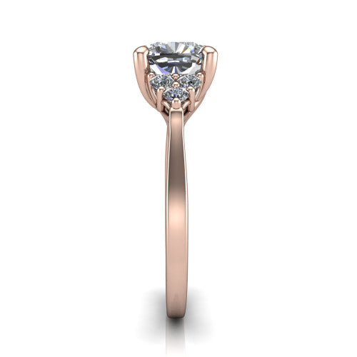 Raegan cushion three stone engagement ring in 18K Rose Gold, side profile showing the cluster head, tall basket, and slim polished band