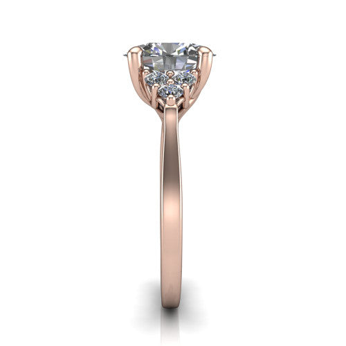 Raegan oval three stone engagement ring in 18K Rose Gold, side profile showing the cluster head, tall basket, and slim polished band