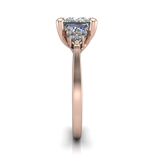 Raegan princess three stone engagement ring in 18K Rose Gold, side profile showing the cluster head, tall basket, and slim polished band