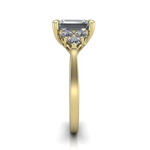 Raegan emerald three stone engagement ring in 14K Yellow Gold, side profile showing the cluster head, tall basket, and slim polished band