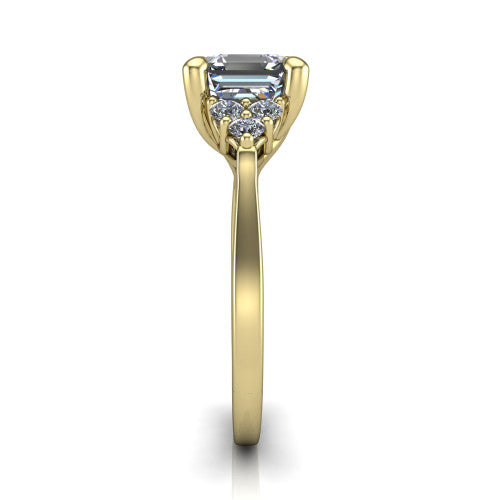 Raegan square emerald three stone engagement ring in 14K Yellow Gold, side profile showing the cluster head, tall basket, and slim polished band