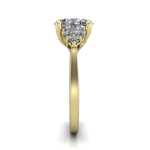 Raegan oval three stone engagement ring in 18K Yellow Gold, side profile showing the cluster head, tall basket, and slim polished band