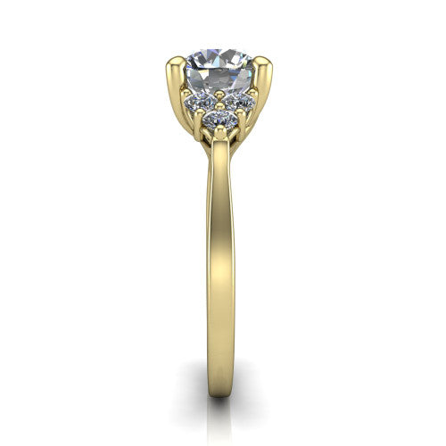 Raegan round three stone engagement ring in 14K Yellow Gold, side profile showing the cluster head, tall basket, and slim polished band
