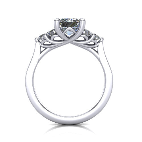 Raegan emerald three stone engagement ring in 18K White Gold, through-finger front profile showing the cluster head and tall straight basket