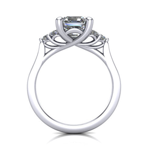 Raegan square emerald three stone engagement ring in Platinum, through-finger front profile showing the cluster head and tall straight basket
