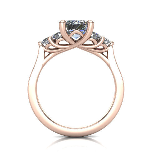 Raegan emerald three stone engagement ring in 14K Rose Gold, through-finger front profile showing the cluster head and tall straight basket