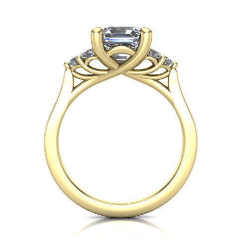 Raegan square emerald three stone engagement ring in 14K Yellow Gold, through-finger front profile showing the cluster head and tall straight basket