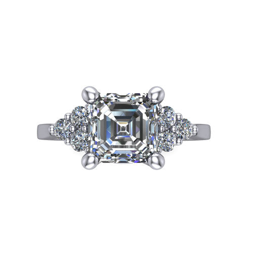 Raegan square emerald three stone engagement ring in Platinum, top-down view showing the step-cut square emerald center diamond with triangular round-diamond clusters on each side