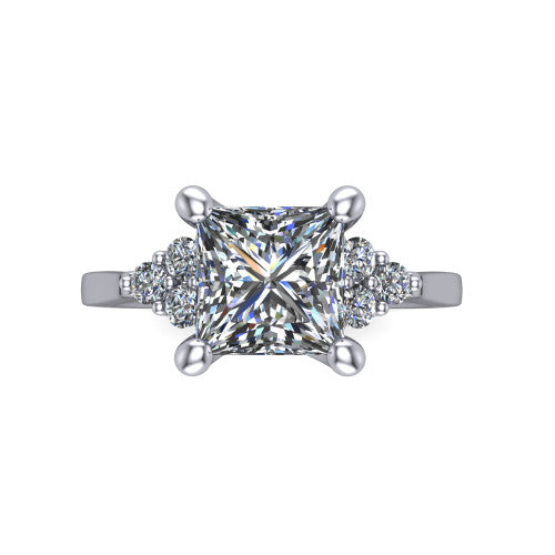 Raegan princess three stone engagement ring in Platinum, top-down view showing the brilliant princess-cut center diamond with triangular round-diamond clusters on each side