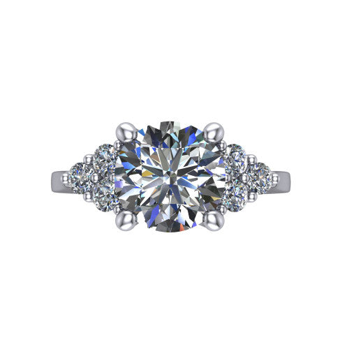 Raegan round three stone engagement ring in 18K White Gold, top-down view showing the brilliant round center diamond with triangular round-diamond clusters on each side