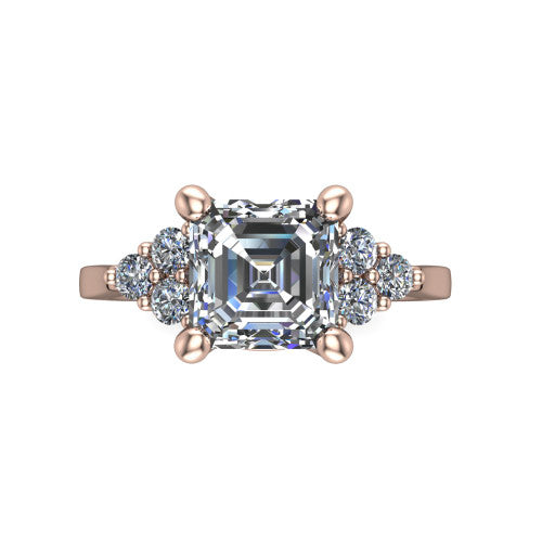 Raegan square emerald three stone engagement ring in 18K Rose Gold, top-down view showing the step-cut square emerald center diamond with triangular round-diamond clusters on each side