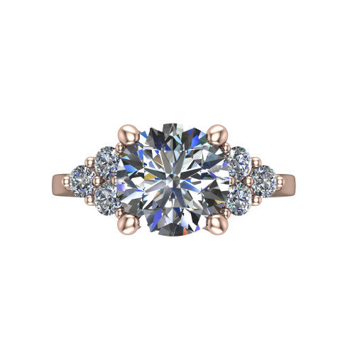 Raegan round three stone engagement ring in 18K Rose Gold, top-down view showing the brilliant round center diamond with triangular round-diamond clusters on each side