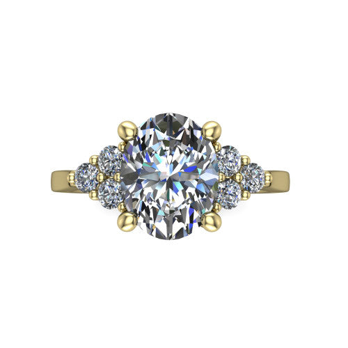 Raegan oval three stone engagement ring in 18K Yellow Gold, top-down view showing the brilliant oval center diamond with triangular round-diamond clusters on each side