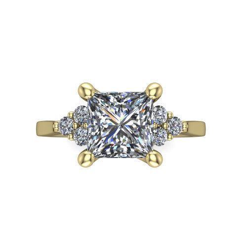 Raegan princess three stone engagement ring in 14K Yellow Gold, top-down view showing the brilliant princess-cut center diamond with triangular round-diamond clusters on each side