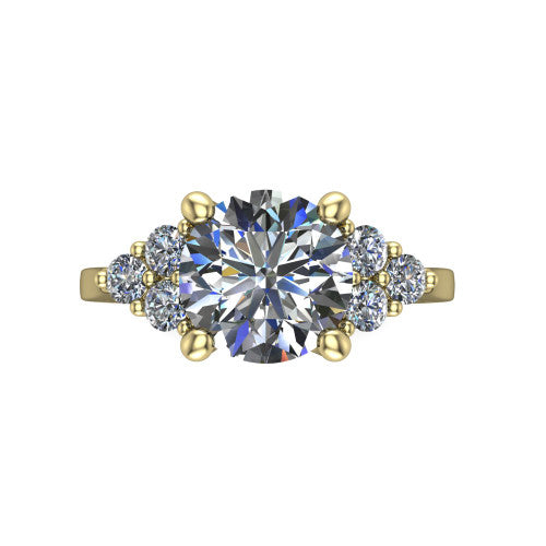 Raegan round three stone engagement ring in 18K Yellow Gold, top-down view showing the brilliant round center diamond with triangular round-diamond clusters on each side