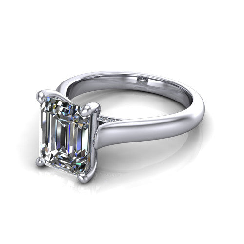 Madilyn emerald solitaire engagement ring in 14K White Gold, three-quarter perspective showing the step-cut emerald center diamond on a slim polished plain band