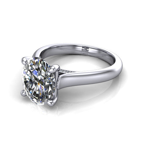 Madilyn oval solitaire engagement ring in 18K White Gold, three-quarter perspective showing the brilliant oval center diamond on a slim polished plain band