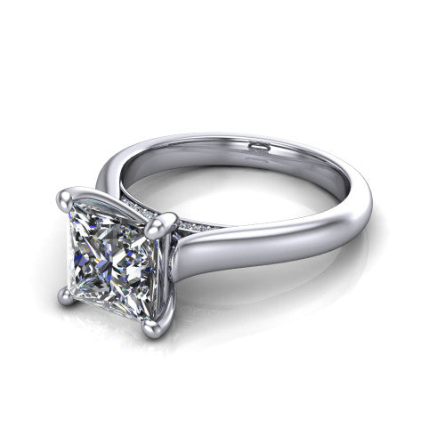 Madilyn princess solitaire engagement ring in 18K White Gold, three-quarter perspective showing the brilliant princess-cut center diamond on a slim polished plain band