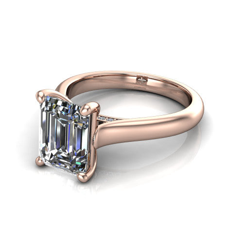 Madilyn emerald solitaire engagement ring in 14K Rose Gold, three-quarter perspective showing the step-cut emerald center diamond on a slim polished plain band