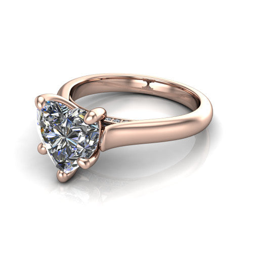 Madilyn heart solitaire engagement ring in 14K Rose Gold, three-quarter perspective showing the brilliant heart-shaped center diamond on a slim polished plain band