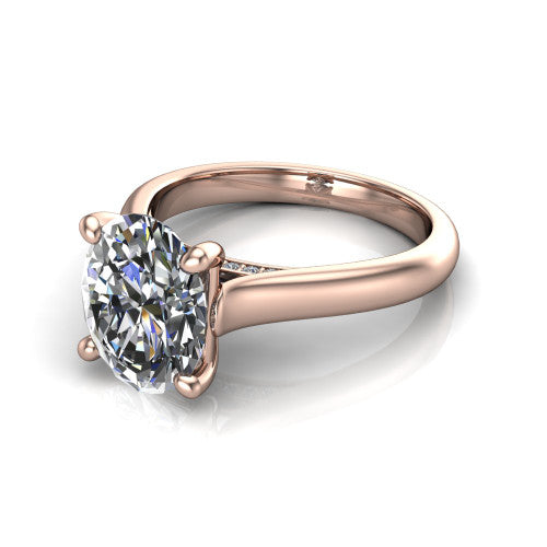 Madilyn oval solitaire engagement ring in 14K Rose Gold, three-quarter perspective showing the brilliant oval center diamond on a slim polished plain band