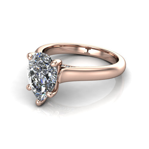 Madilyn pear solitaire engagement ring in 14K Rose Gold, three-quarter perspective showing the brilliant pear-cut center diamond on a slim polished plain band