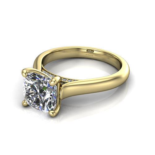 Madilyn cushion solitaire engagement ring in 14K Yellow Gold, three-quarter perspective showing the brilliant cushion-cut center diamond on a slim polished plain band